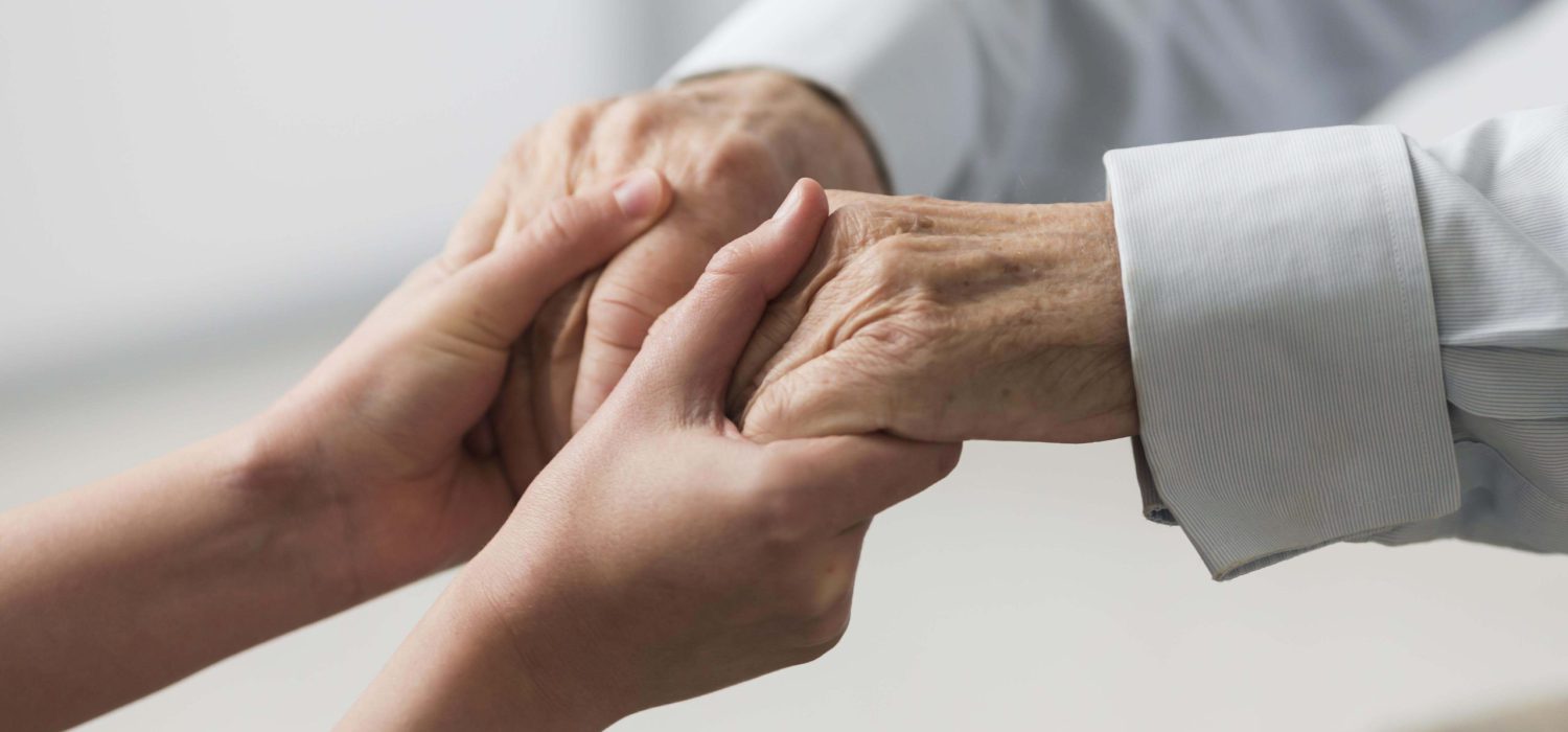 nurse-holding-senior-man-s-hands-sympathy nurse-holding-senior-man-s-hands-sympathy